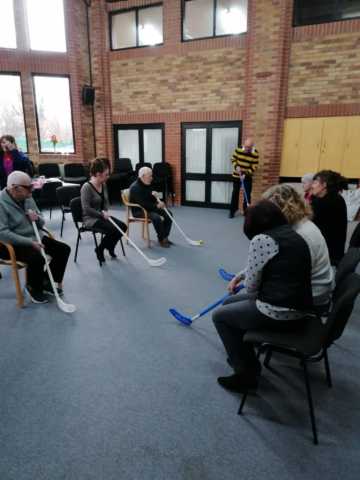 Phoenix Day center playing chair hockey