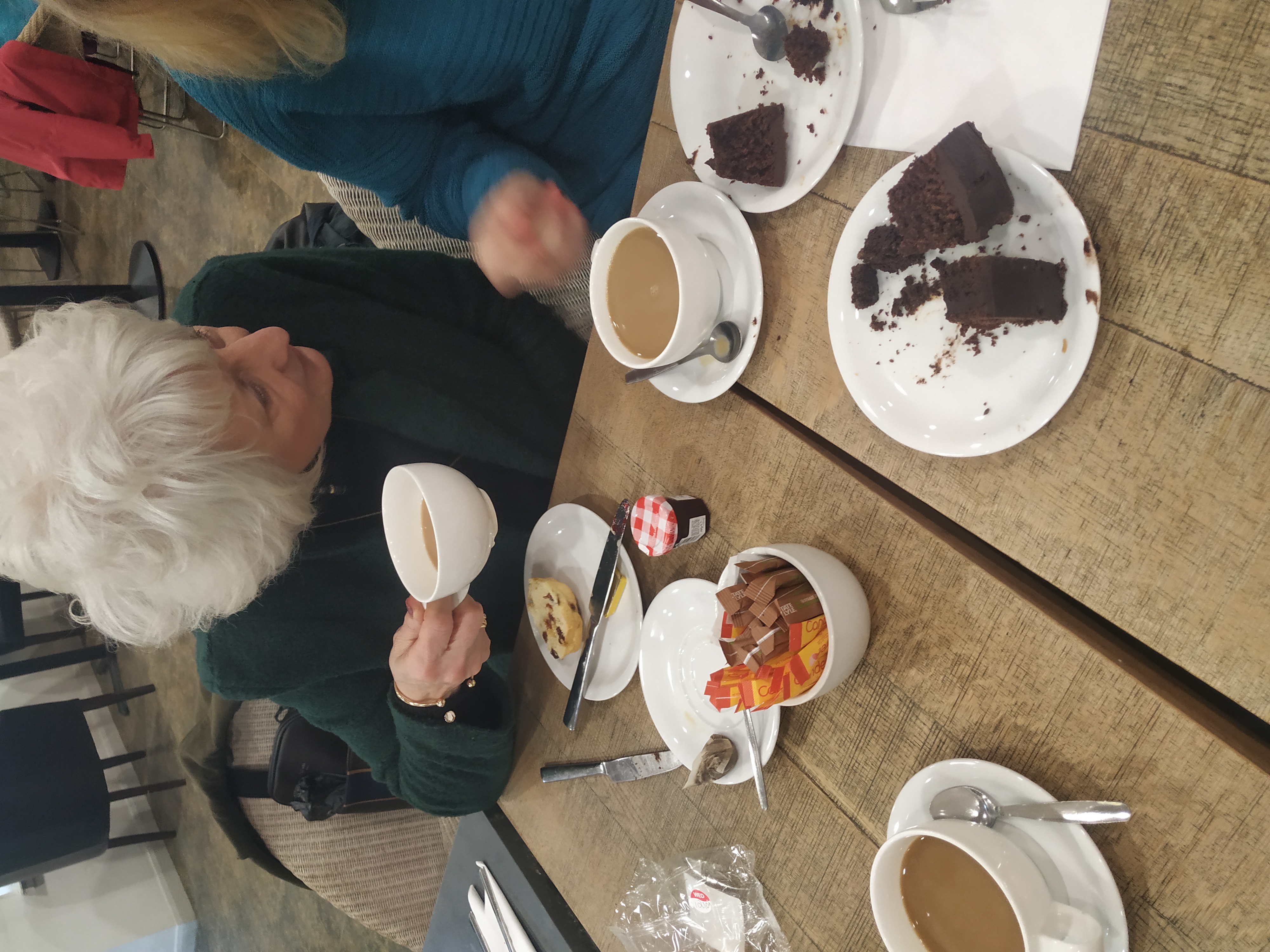 Service users having lunch at a trip to the garden centre