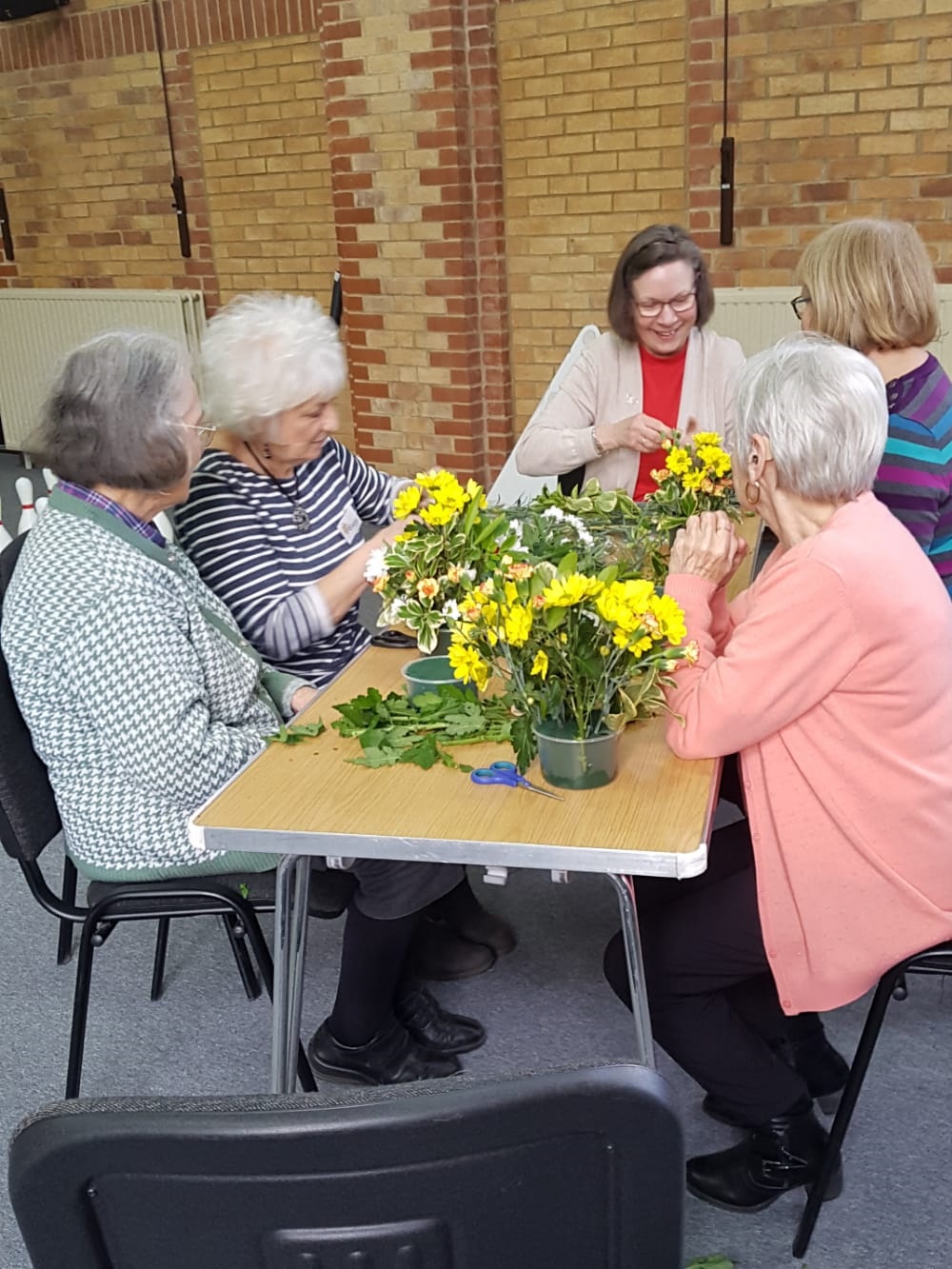 Services users arranging flowers